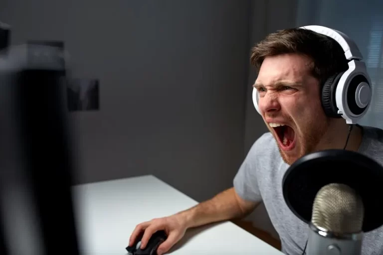 Man screaming at computer screen