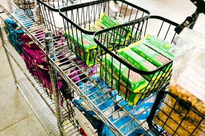 A discounted display of heart-shaped Valentine's Day merchandise on clearance in a small-town grocery store aisle.