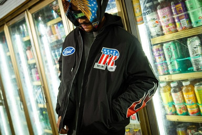 The glass doors of a convenience store walk-in beer cooler, lit from inside