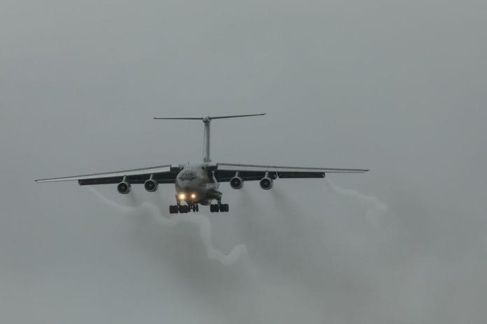 Military Aid Shipment Paused A military cargo aircraft on a tarmac with pallets of supplies, the kind of shipment now suspended under the administration's pause on aid to Ukraine.