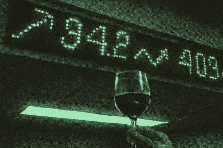 A green stock ticker glows above a raised wine glass in cold fluorescent light.